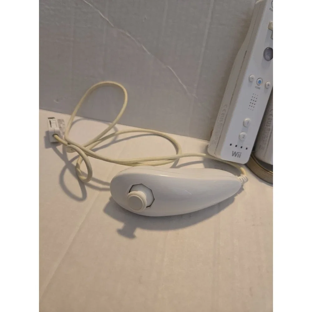 Pair Of Nintendo Wii Remotes With Nunchucks